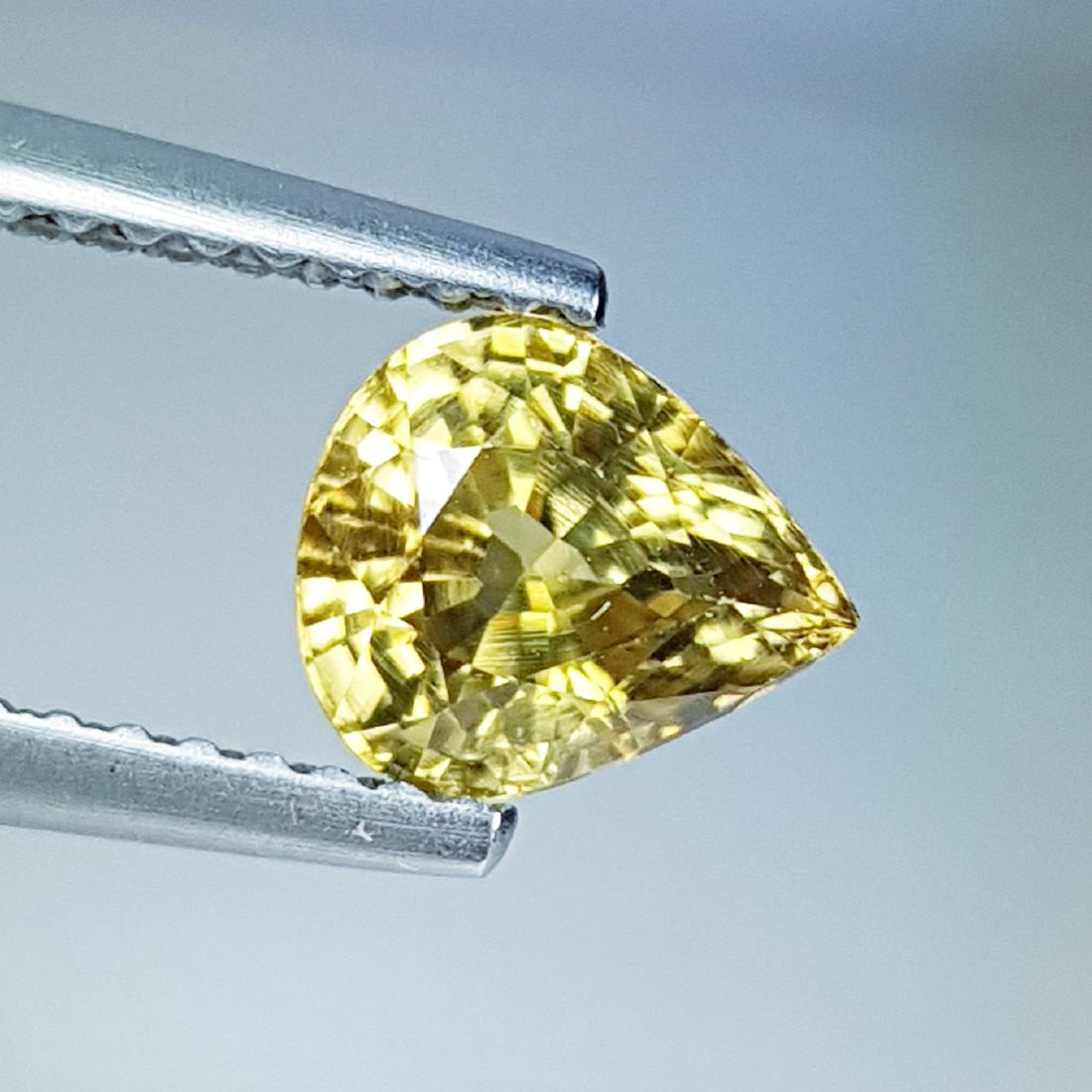 Natural Golden Yellow Zircon - 1.75 ct: Item: Natural Golden Yellow Zircon - 1.75 ct Loose Gemstone: Zircon Color/Clarity: VS Carat Weight: 1.75 Size (mm): 7.10 x 6.12 x 4.45 Pear - Cambodia No Reserve: This lot starts at $1 and has no rese