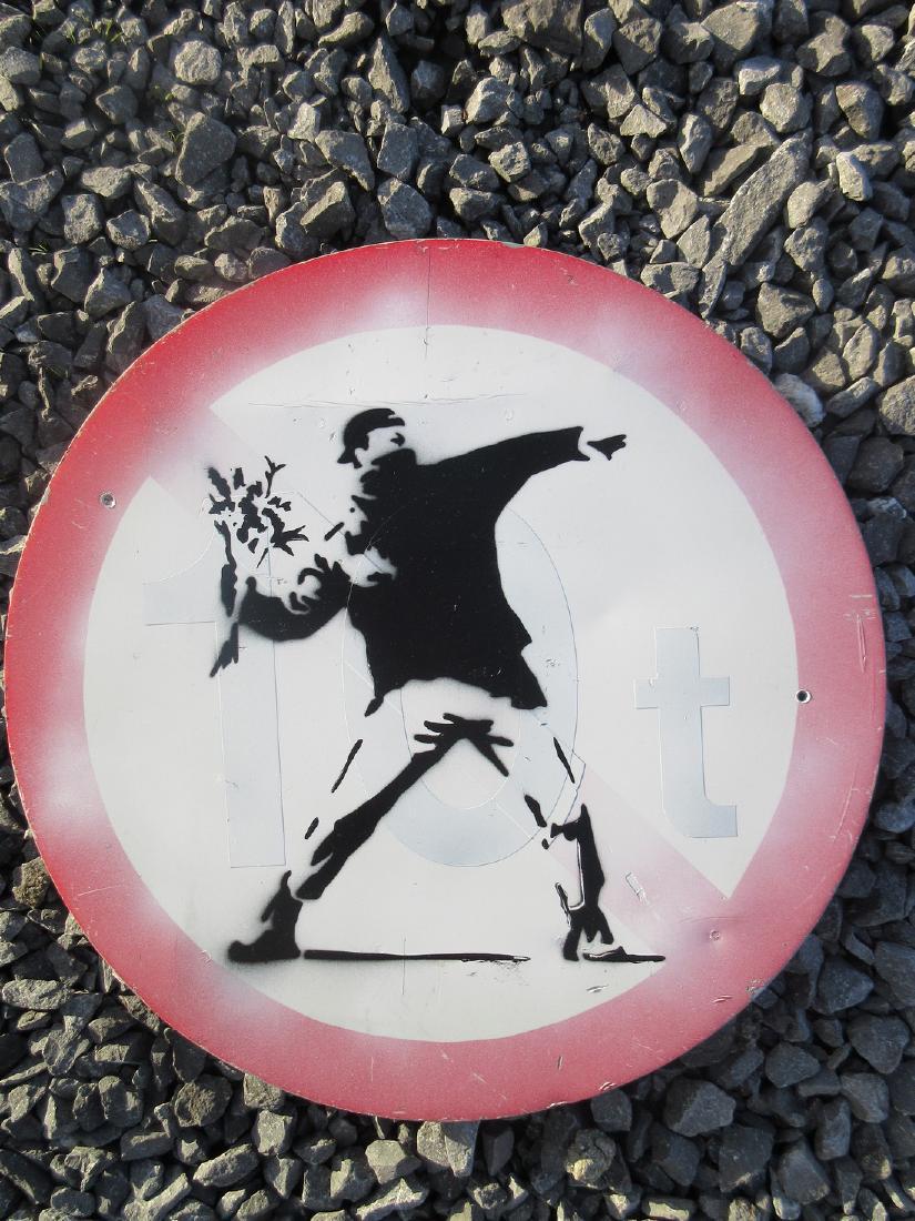 Banksy Flower Thrower spray paint on metal road sign (1 of 4)