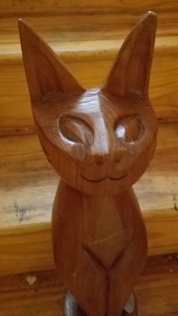 Art deco modern cat wood carving cherry 1950 20": Neat piece . Carved cherry wood I think. Love the face. Believe it dates to 1960 period. . Approximately 20" high. Shipping includes insurance. Please note that this lot has a confidential reserve. Wh