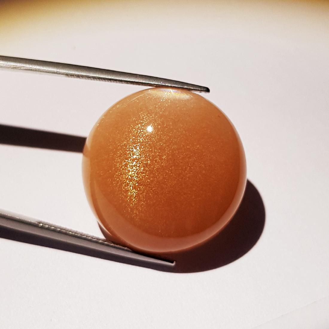 Natural Galaxy Moonstone - 44.92 ct: No Reserve! Item: Natural Galaxy Moonstone - 44.92 ct Color/Clarity: Semi - Transparent Loose gemstone Carat Weight: 44.92 Size (mm): 25.18 x 25.13 x 10.10 Round - Tamilnadu Shipping: Worldwide: Flat-