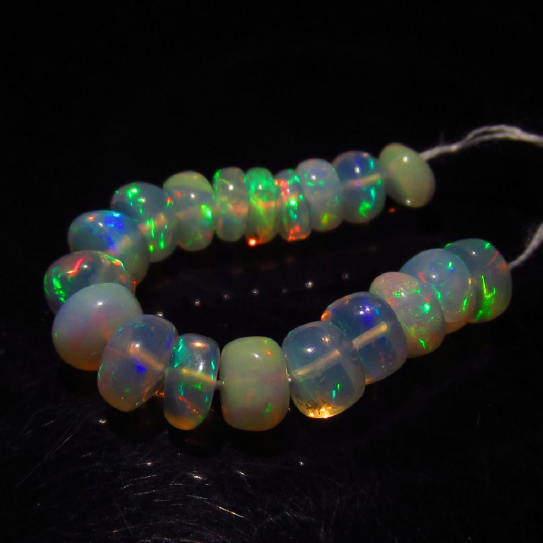4.08 Ct Genuine 19 Loose Drilled Round Multi-Color Fire: No Reserve! Item: 4.08 Ct Genuine 19 Loose Drilled Round Multi-Color Fire Opal Beads Loose Gemstone: Natural Opal Beads Stone Clarity: Transparent Carat Weight: 4.08 Size/Dimensions: 3.7 to 4.6 mm / 1