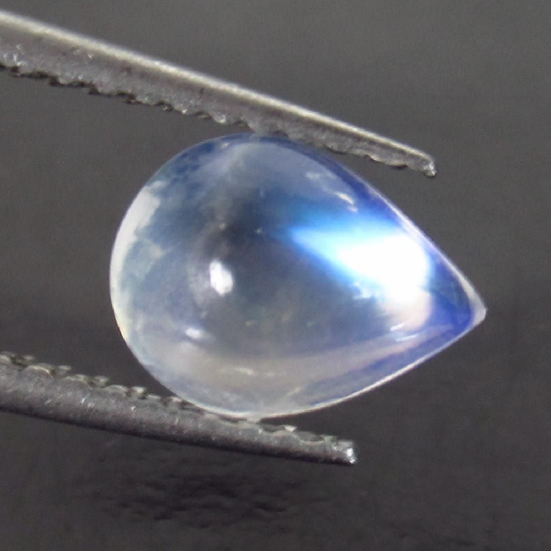 1.34 Ct Genuine Blue Moonstone 8X6 mm Pear Cabochon: No Reserve! Item: 1.34 Ct Genuine Blue Moonstone 8X6 mm Pear Cabochon Loose Gemstone: Natural Blue Moonstone Stone Clarity: Transparent Carat Weight: 1.34 Size/Dimensions: 8.10 x 6.10 x 4.20 mm Blue T