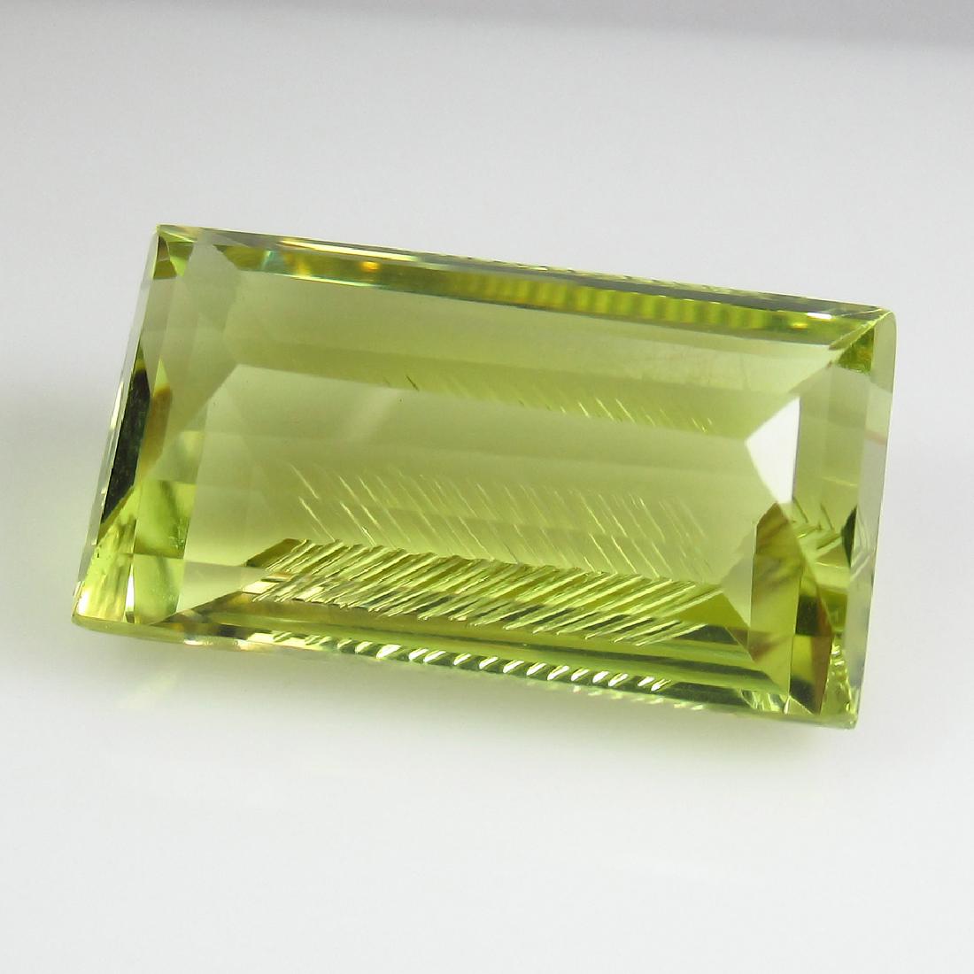 19.54 Ct Genuine Fancy Rectangle Cut Lemon Quartz: No Reserve! Item: 19.54 Ct Genuine Fancy Rectangle Cut Lemon Quartz Loose Gemstone: Natural Lemon Quartz Stone Clarity: IF Carat Weight: 19.54 Size/Dimensions: 20.70 x 11.80 x 9.30 mm Top Class Luster