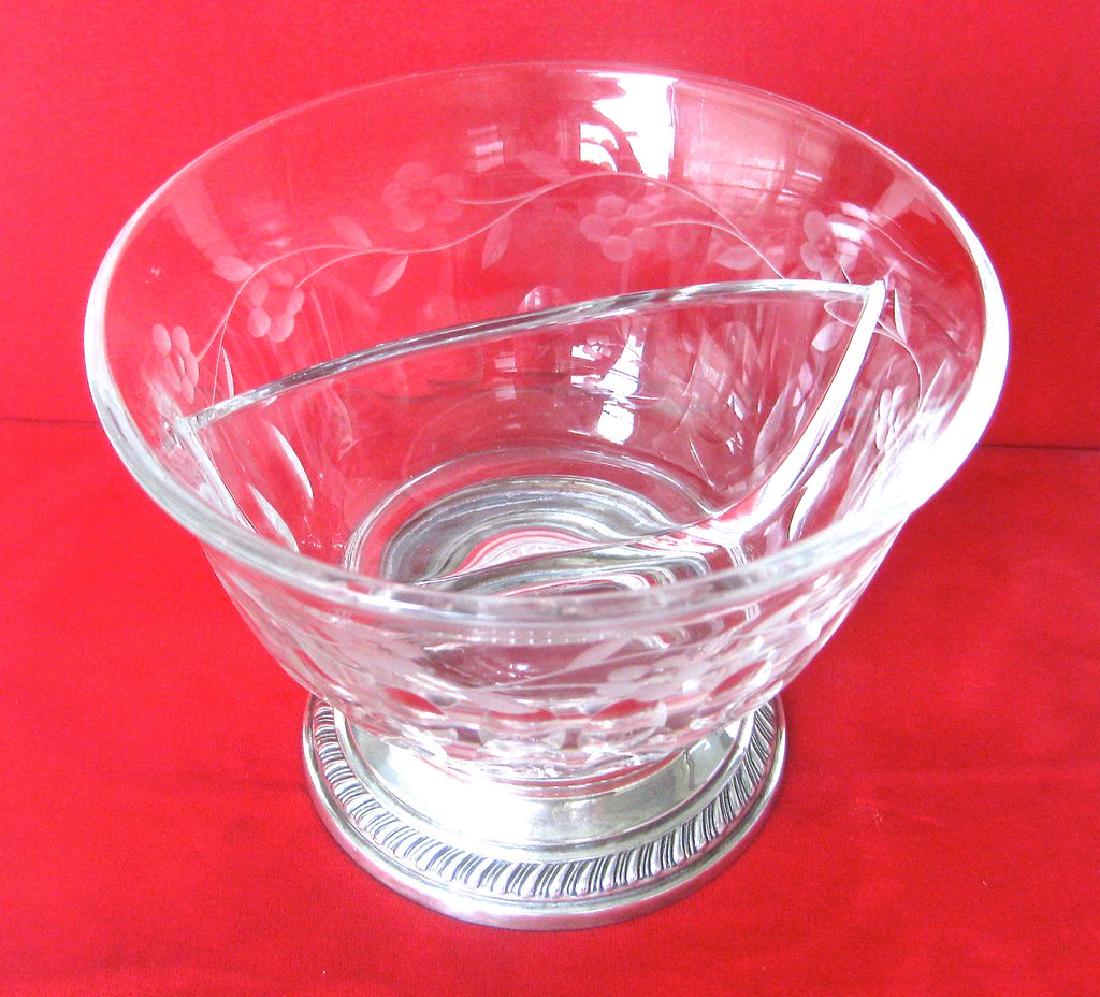 Heisey Crystal and Sterling Silver Divided Bowl: Heisey Bowl circa. 1940 American Etched glass bowl with flowers and other decorations, the bowl has a center glass divider. Great to display two different candies The base of the bowl is sterling silv