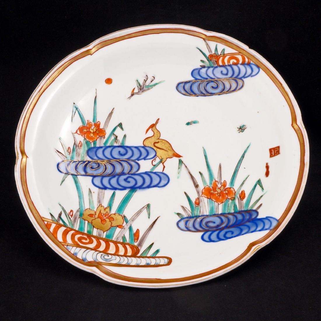 Japanese porcelain Meiji era (1868-1912) deep plate: Reserve Reduced! Beautiful Japanese plate with wonderful paintings of little bugs, iris, and birds. Large Japanese porcelain plate with a lobed edge. The plate is painted in overglaze blue, red, green