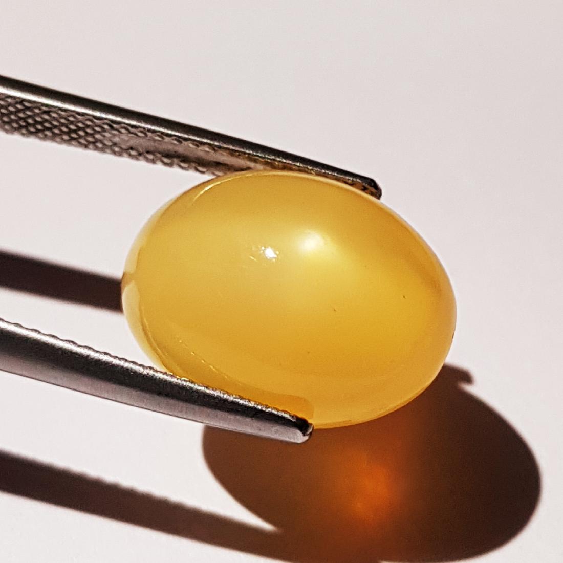 16.30 ct Natural Peach Orange Moonstone: No Reserve! Item: 16.30 ct Natural Peach Orange Moonstone Loose Gemstone: Moonstone Cat's Eye Color/Clarity: Semi - Transparent Carat Weight: 16.3 Size (mm): 15.40 x 12.60 x 10.80 Oval - Tamilnadu Shi