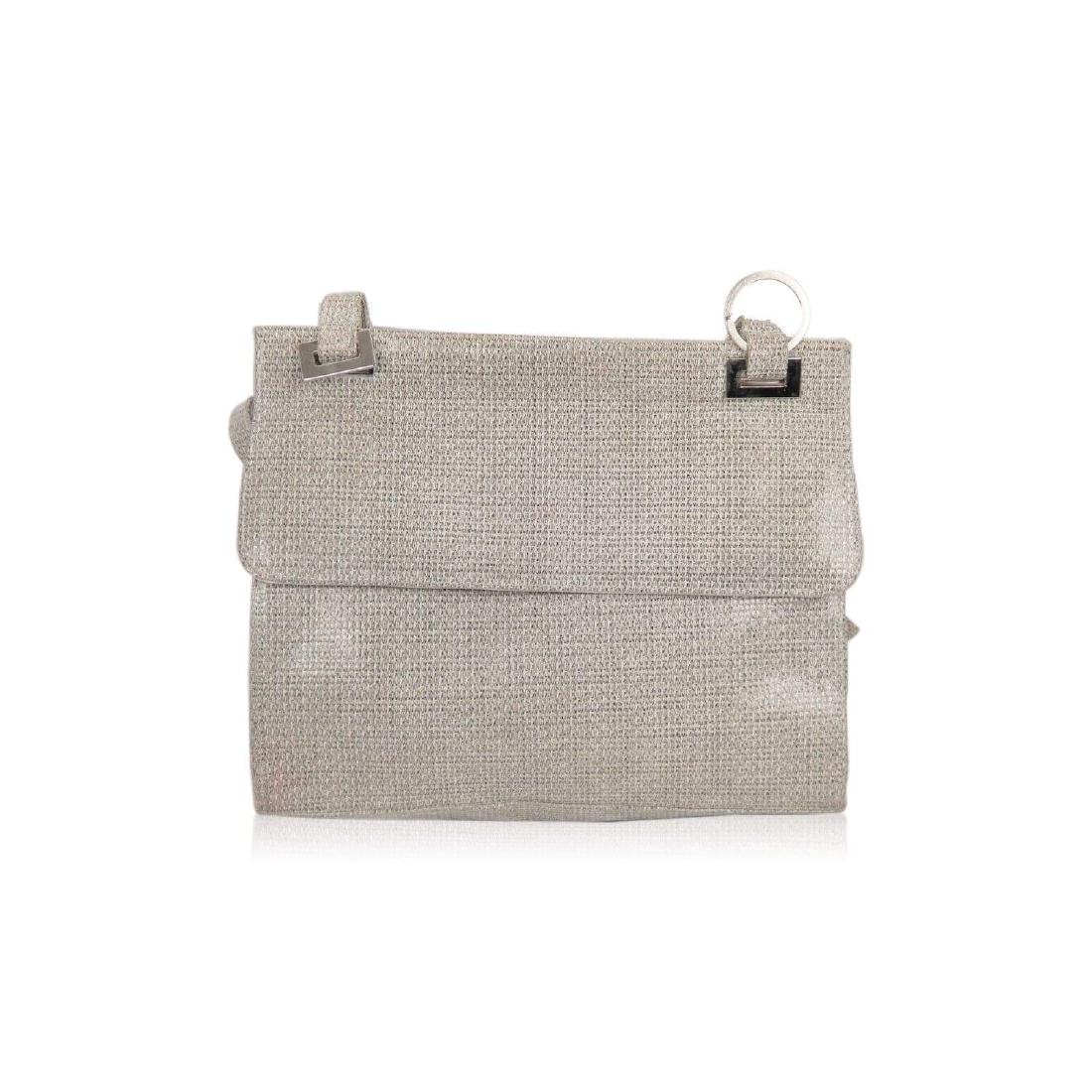 STUART WEITZMAN Shiny Canvas SHOULDER BAG: STUART WEITZMAN Shiny Canvas SHOULDER BAGby: Stuart WeitzmanStuart Weitzman shoulder bag crafted in patterned shiny canvas. Silver metal hardware. Flap with magnetic button closure. 1 side zip pocket