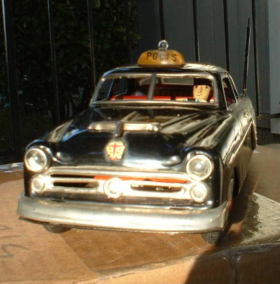 Marusan (Japan) Cadillac "A-1957" police car, battery: Marusan (Japan) Cadillac "A-1957" police car, battery operated, top light flashes, alarm sounds, car starts, runs, stops, the cycle repeats, extremely rare design for the Swedish market, c9, . Reserve