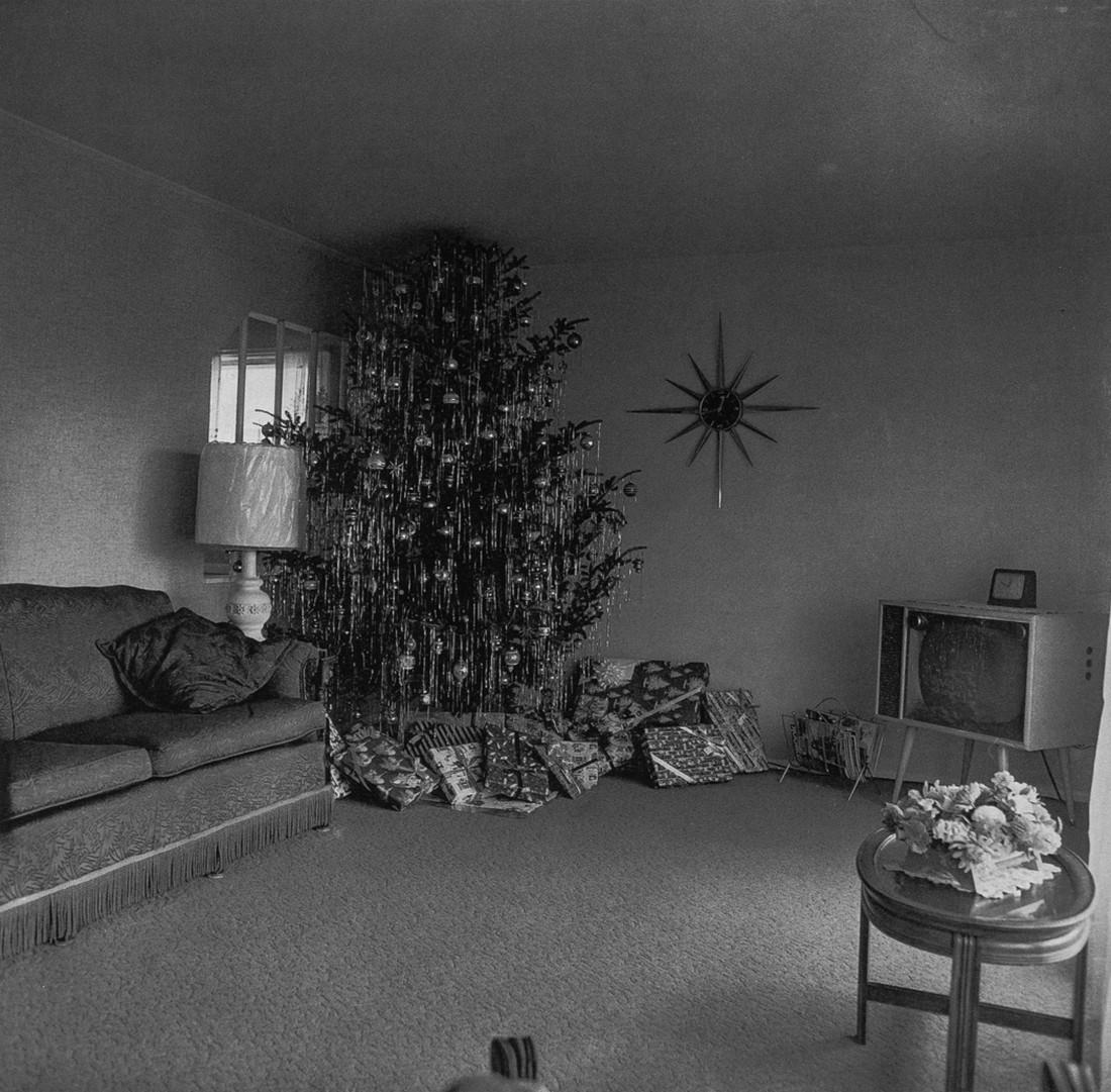 DIANE ARBUS - Xmas Tree in Living Room, Levittown, 1963: Artist: Arbus, Diane Title: Xmas Tree in Living Room, Levittown, 1963 Medium: Photo Litho, 1975, USA Dimensions: 6x5.8" Heat Wax Mounted on 8.5x11" Conservation Board Diane Arbus was an American photo