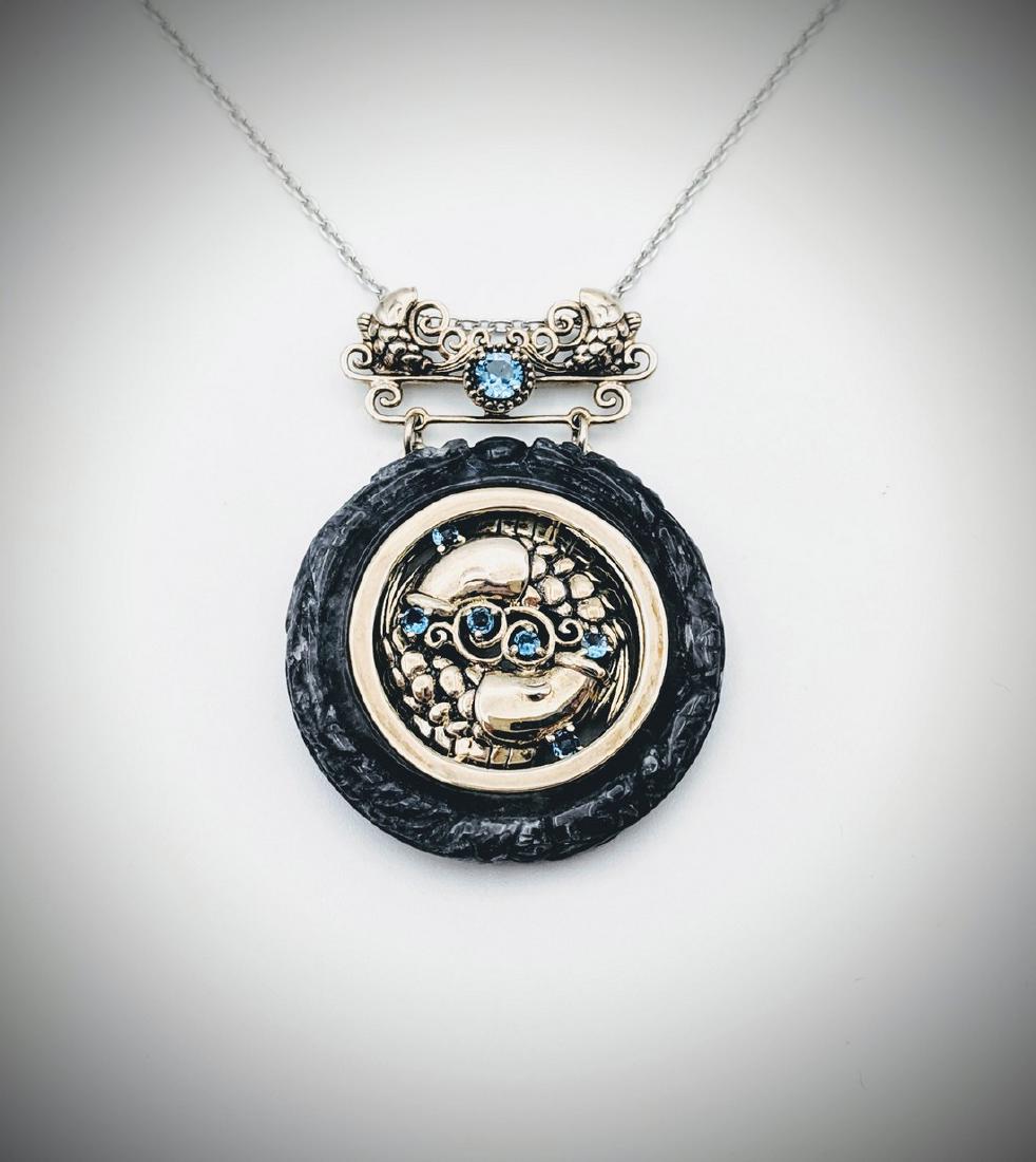 Nuumite & Blue Topaz Pendant w Koi Fish Design &: Title: Nuumite & Blue Topaz Pendant w Koi Fish Design & Necklace Brand: Jean Lin Collection Metal Purity: 925 Sterling Silver Gemstones: Nuumite & Blue Topaz Carat Weights: Pendant has 1 Nuumite at 34
