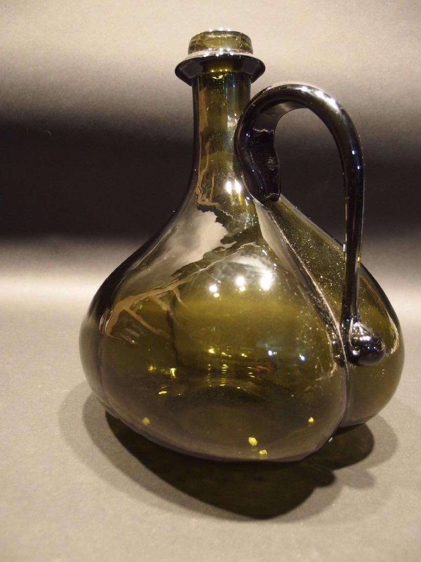 Blown Onion Bottle With Handle Black Green Glass: Blown Onion Bottle With Handle Antique Vintage Style Colonial Black Green Glass Description 10" tall x 8" Tall Great reproduction onion bottle with a polished pontil. See the images the bottom some ma