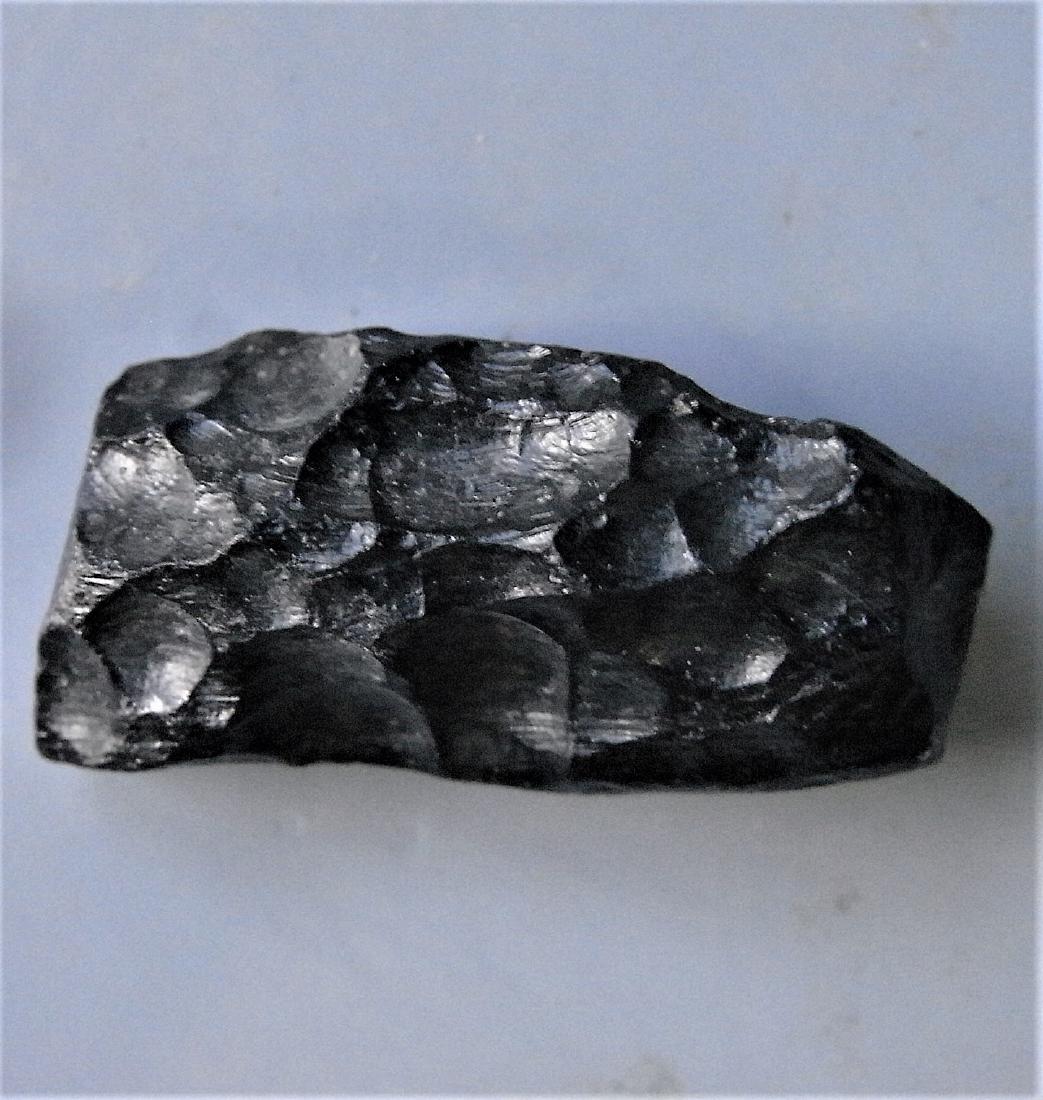 THAILANDITE TEKTITE FROM METEORITE IMPACT: Title: THAILANDITE TEKTITE FROM METEORITE IMPACT Origin: Noen Sa-Nga, Chaiyaphum Province, Thailand Size: 2x1x0.8 cm / 3 gram glossy, flattened, elongate thailandite tektite with smooth and pitted sid