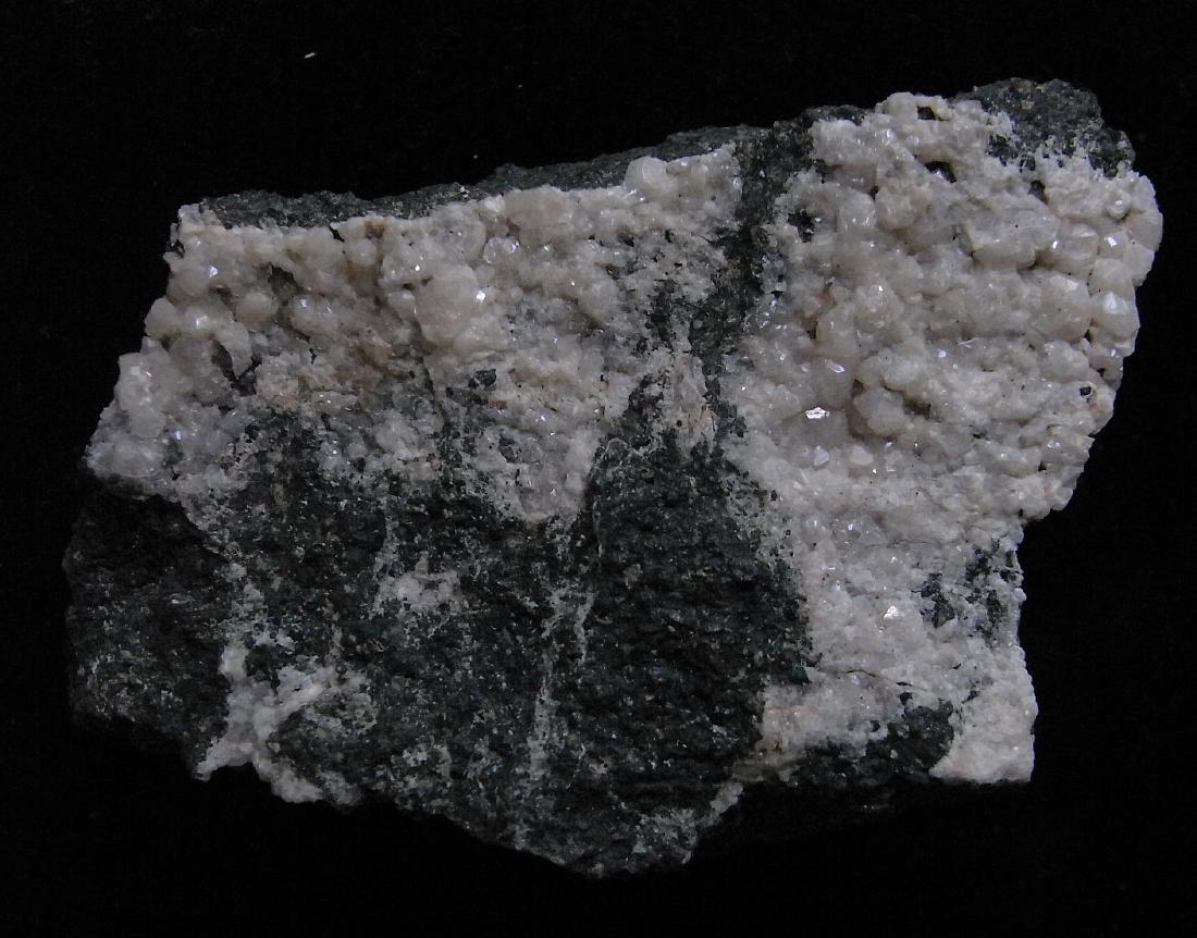 LIGHT PINK ANALCIME ON BASALT MATRIX (1 of 5)