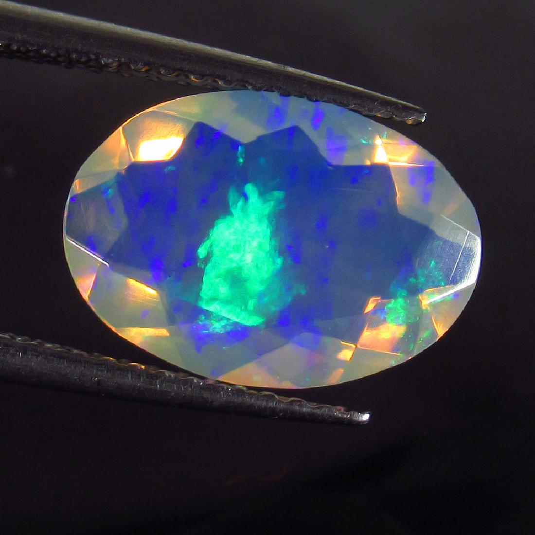 1.75 Ct Genuine Ethiopian Faceted Opal 12X8.5 mm Oval (1 of 2)