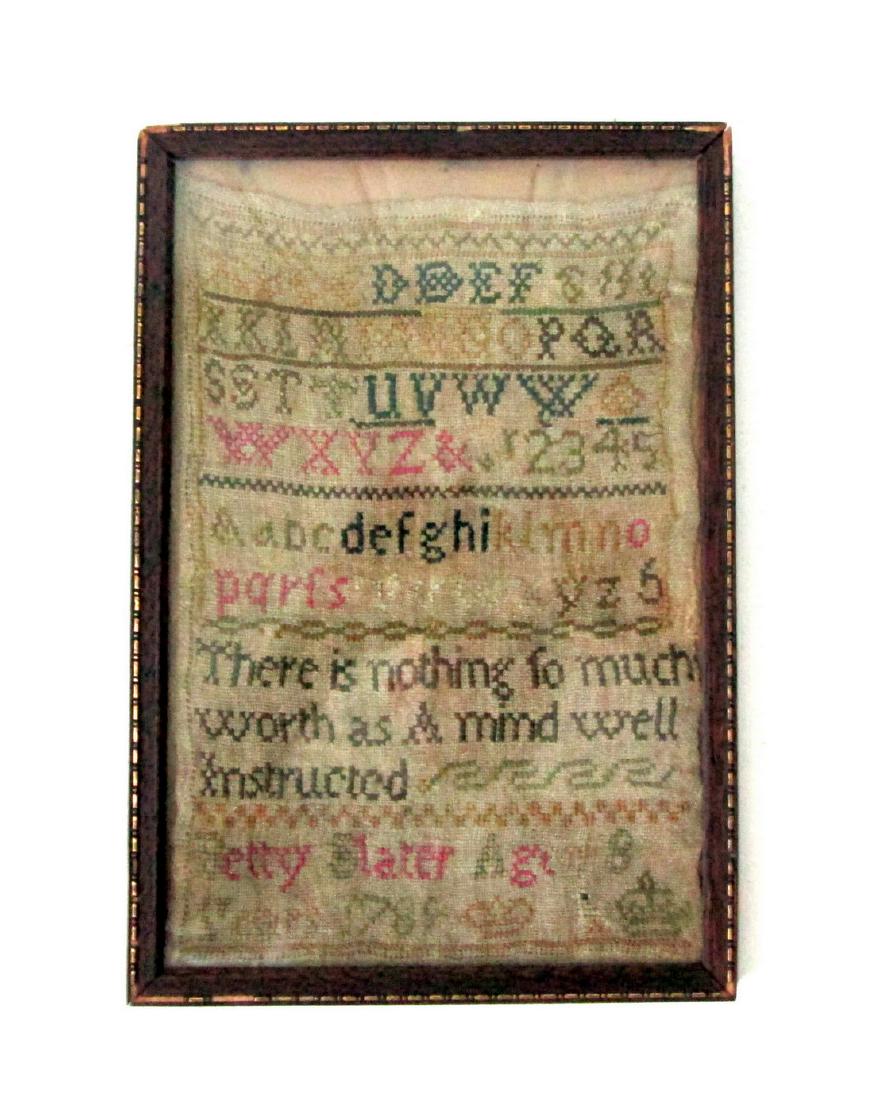 Dated 1789 Sampler: Title: Dated 1789 Sampler Date: Material: Silk on Linen Dimensions: 13 3/4”H X 8 3/4”W X 1/2”D Retaining strong color, silk on coarse linen, “Betty Slater, Age 8 Years, 1789”. Alphabet & num