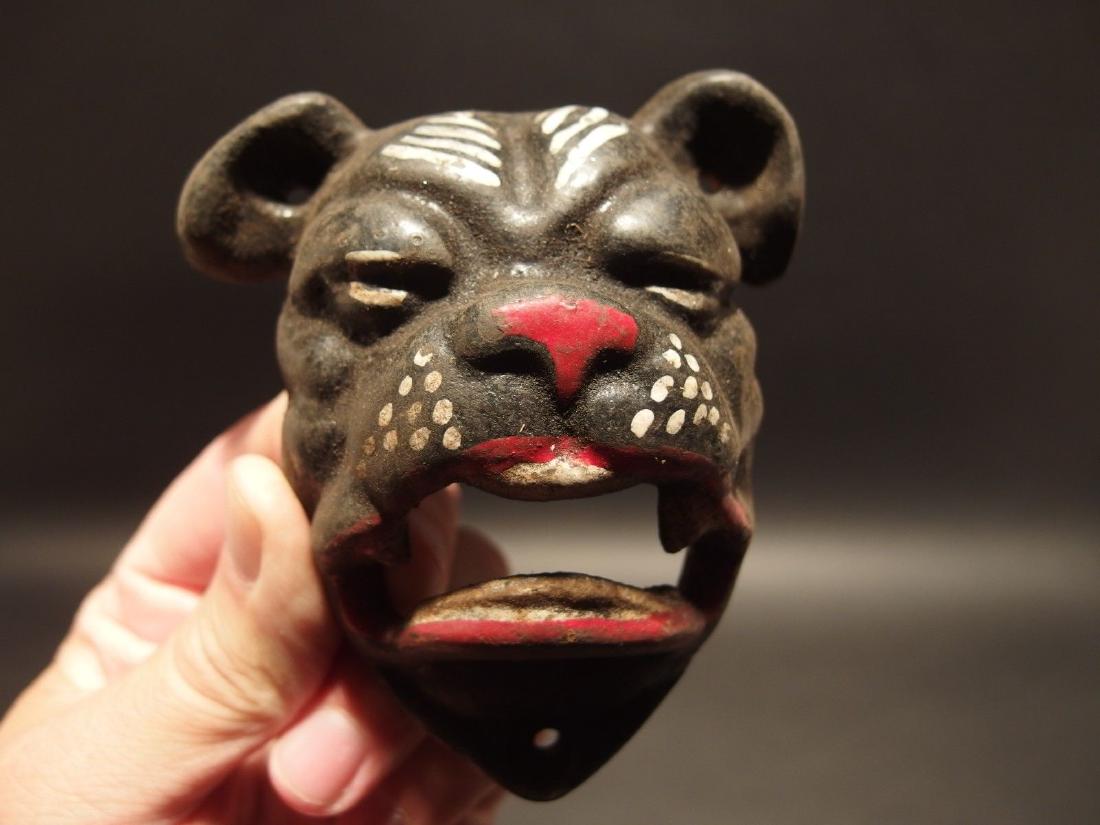 Cast Iron wall mount folk art Bulldog Beer Bottle: 4" Tall x 3 1/2" Wide Such a neat reproduction antique cast iron bulldog wall mounted bottle cap opener. The mouth of the bulldog is where you would open the bottle. Certainly a great accent piece! Be