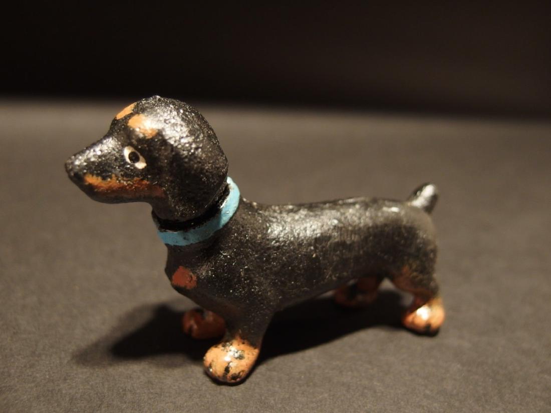Cast Iron Dachshund Dog: 3" Wide 3/4" Thick Nice reproduction of an antique compass. Great heavy quality piece made to look like an original! Reserve: $10.00 Shipping: Domestic: Flat-rate of $5.00 to anywhere within the conti