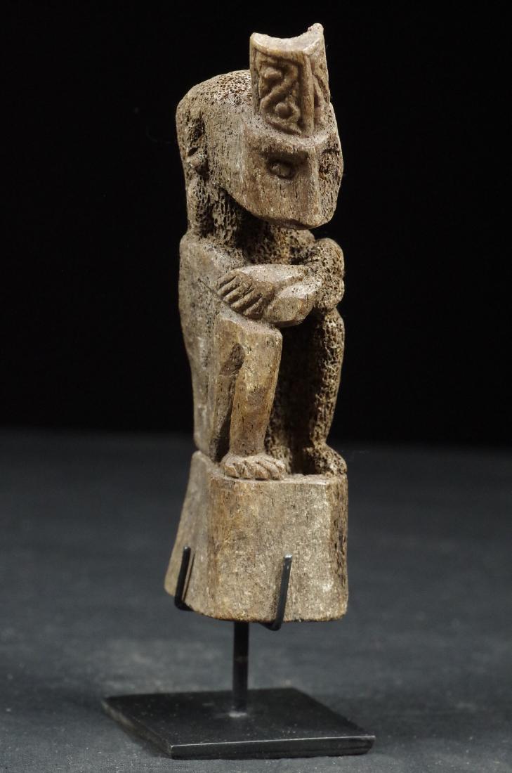Fish bone figure of ancestor: Reserve Reduced! DIMENSIONS: stand excluded, cm 16 (inch 6.2" ) WEIGHT: 260 g ca. DESCRIPTION: Bone figure depicting sitting ancestor, from the Atoni tribes of central highlands of West Timor. Acquire