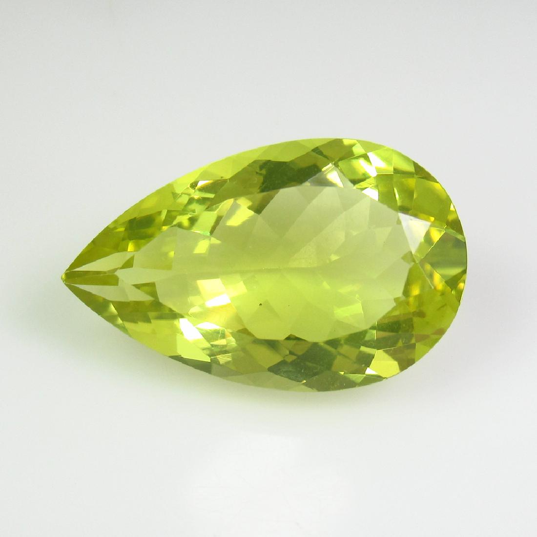 11.92 Ct Genuine Bright Lemon Quartz 20X13 mm Pear Cut: No Reserve! Title: 11.92 Ct Genuine Bright Lemon Quartz 20X13 mm Pear Cut Natural Lemon Quartz Pear Stone Clarity: IF Gemstones: Lemon Quartz Carat Weights: 11.92 Size/Dimensions: 21.00 x 12.90 x 8.30