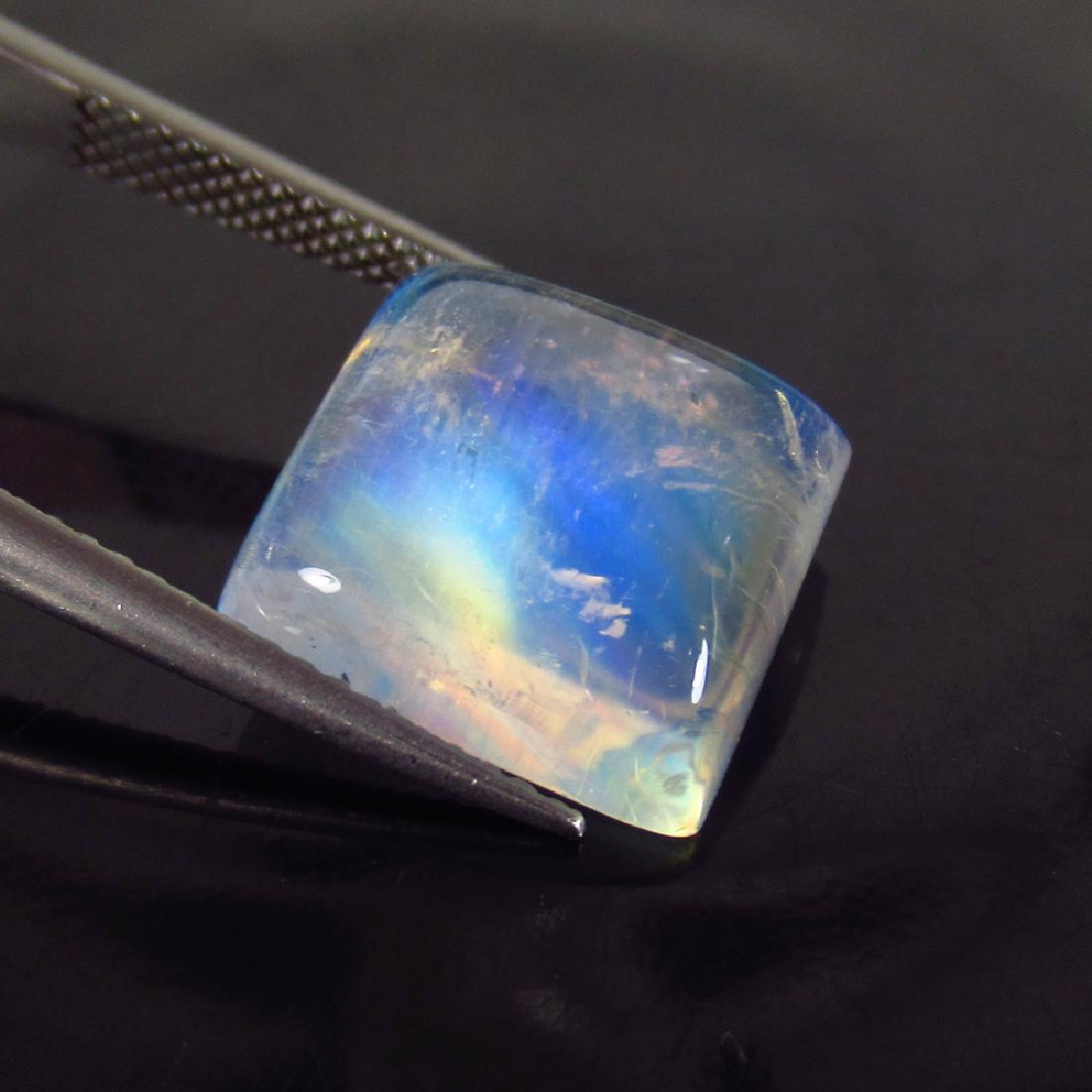7.79 Ct Genuine Blue Moonstone 12X12 mm Square Cabochon: No Reserve! Title: 7.79 Ct Genuine Blue Moonstone 12X12 mm Square Cabochon Natural Blue Moonstone Stone Clarity: Transparent Gemstones: Moonstone Carat Weights: 7.79 Size/Dimensions: 12.20 x 12.10 x 5