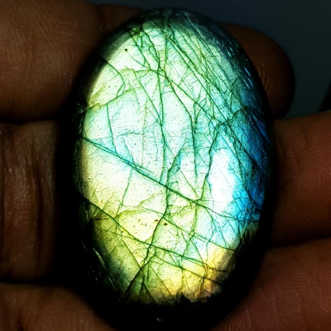58.72 ct Natural Labradorite: No Reserve! Item: 58.72 ct Natural Labradorite Color/Clarity: Opaque Gemstones Carat Weights: 58.72 Size/Dimensions: 37.01 x 23.55 x 8.08 Oval - USA Shipping: Worldwide: Flat-rate of $10.00 to anywher