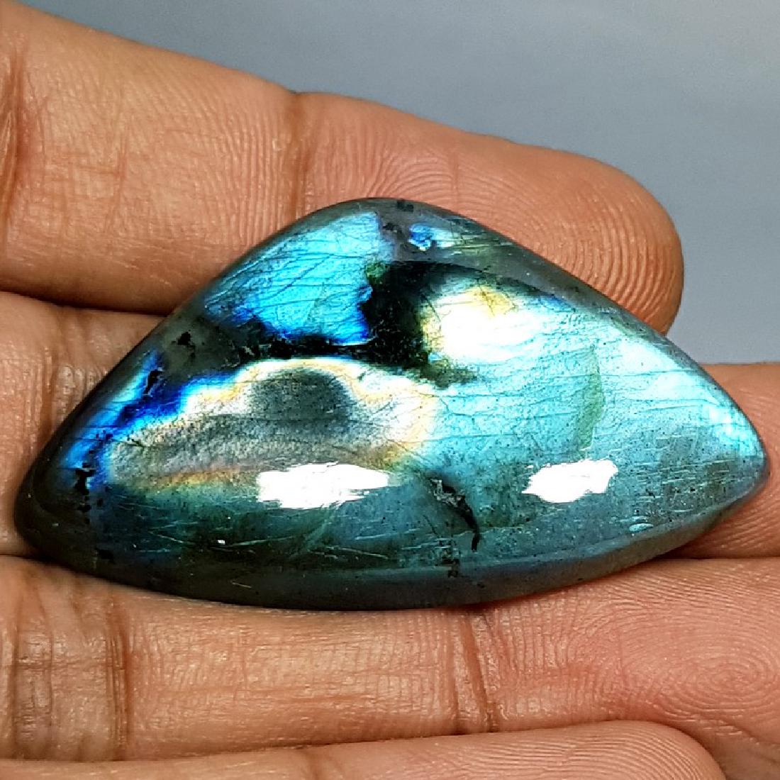 55.92 ct Natural Labradorite: No Reserve! Item: 55.92 ct Natural Labradorite Color/Clarity: Opaque Gemstones Carat Weights: 55.92 Size/Dimensions: 43.42 x 26.33 x 6.88 Pear - USA Shipping: Worldwide: Flat-rate of $10.00 to anywher
