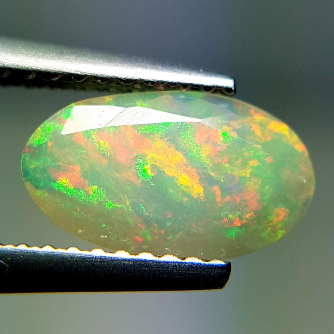 0.84 ct Beautiful Fire Oval Cut Natural Ethiopian Opal (1 of 6)