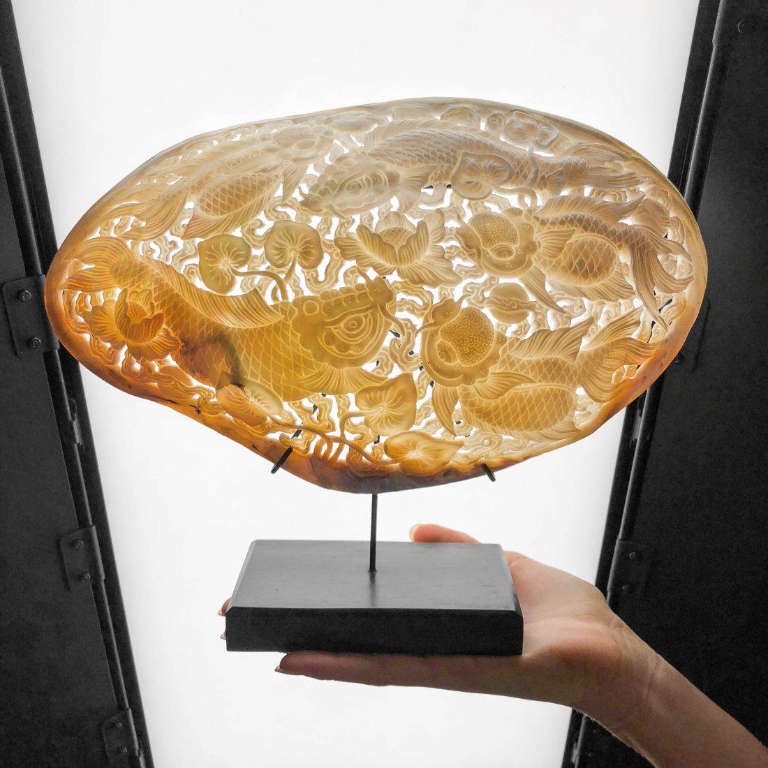 Engraved pearl shell - Japanese KOI Fish: Item: Engraved pearl shell - Japanese KOI Fish Maker: Design: Jake Richmond Origin: Indonesia Date/Period: 2016 Materials: Shell, Wood Dimensions: Width including stand 28cm / 11 inches Completely eng