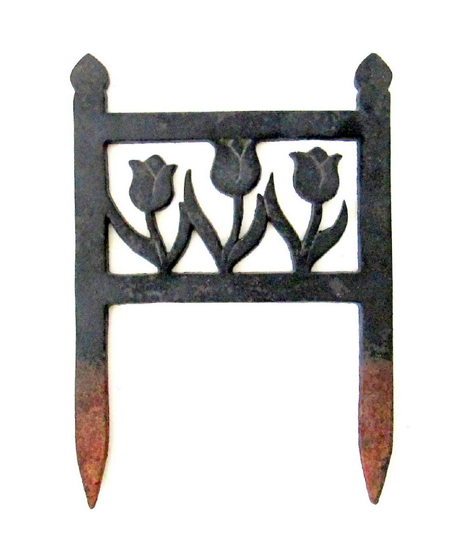 Tulips Boot Scraper: Title: Tulips Boot Scraper Date: C 1920-40 Material: Cast Iron Dimensions: 13”H X 9”W X 1/4”D Dry original black painted surfaces, stylish form, the tulips with incised designs. Light oxidation,