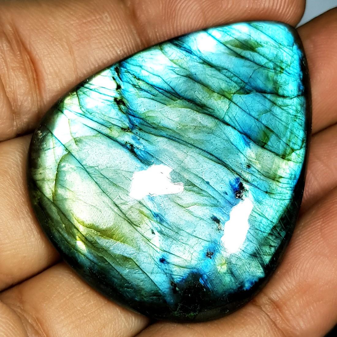 81.39 ct Natural Labradorite: No Reserve! Item: 81.39 ct Natural Labradorite Color/Clarity: Opaque Loose gemstone Carat Weights: 81.39 Size/Dimensions: 44.87 x 36.87 x 6.68 Pear - USA Shipping: Domestic: Flat-rate of $10.00 to any