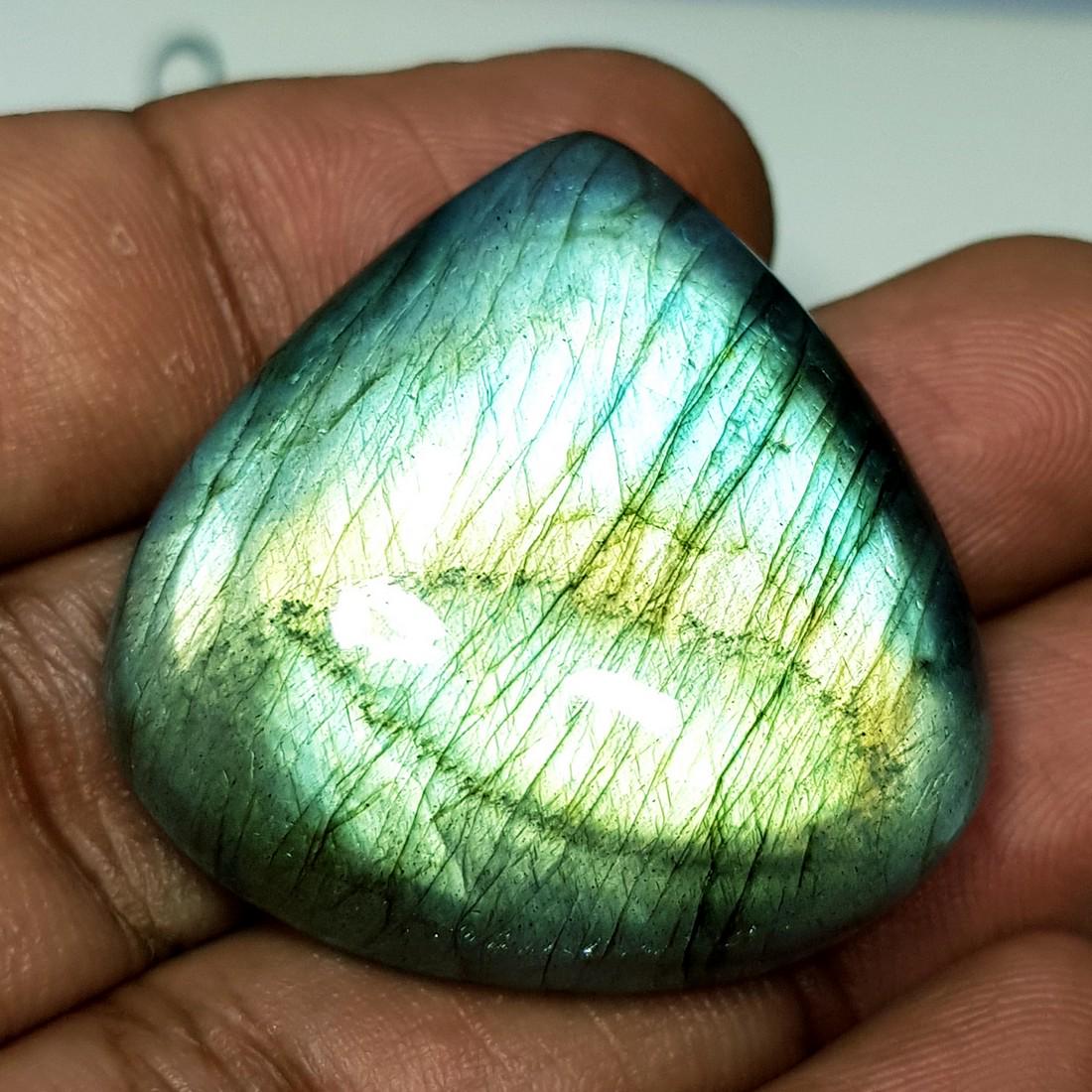 76.01 ct Natural Labradorite: No Reserve! Item: 76.01 ct Natural Labradorite Color/Clarity: Opaque Loose gemstone Carat Weights: 76.01 Size/Dimensions: 33.58 x 32.23 x 9.34 Pear - USA Shipping: Domestic: Flat-rate of $10.00 to any