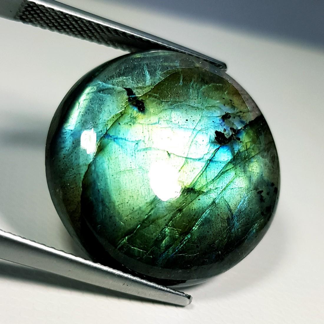 28.83 ct Natural Labradorite: No Reserve! Item: 28.83 ct Natural Labradorite Color/Clarity: Opaque Loose gemstone Carat Weights: 28.83 Size/Dimensions: 23.20 x 23.20 x 6.46 Round - USA Shipping: Domestic: Flat-rate of $10.00 to an
