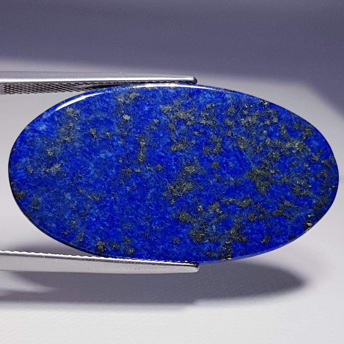 23.38 ct Natural Lapis Lazuil: No Reserve! Item: 23.38 ct Natural Lapis Lazuil Color/Clarity: Opaque Loose gemstone Carat Weights: 23.38 Size/Dimensions: 36.85 x 20.23 x 2.61 Oval - Afghanistan/Chile Shipping: Domestic: Flat-rate o