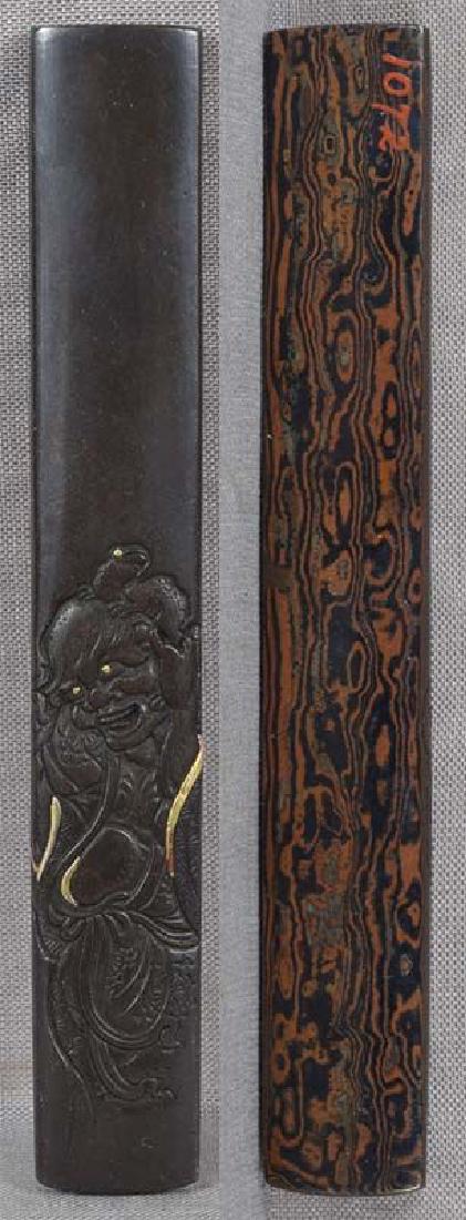 19c Japanese sword KOZUKA Gama Sennin with toads: One 19th century Japanese kozuka (sword knife) handle with low relief decoration of Gama Sennin helping his regular familiar - a three-legged toad - to climb onto his head. The back is done in mokume-