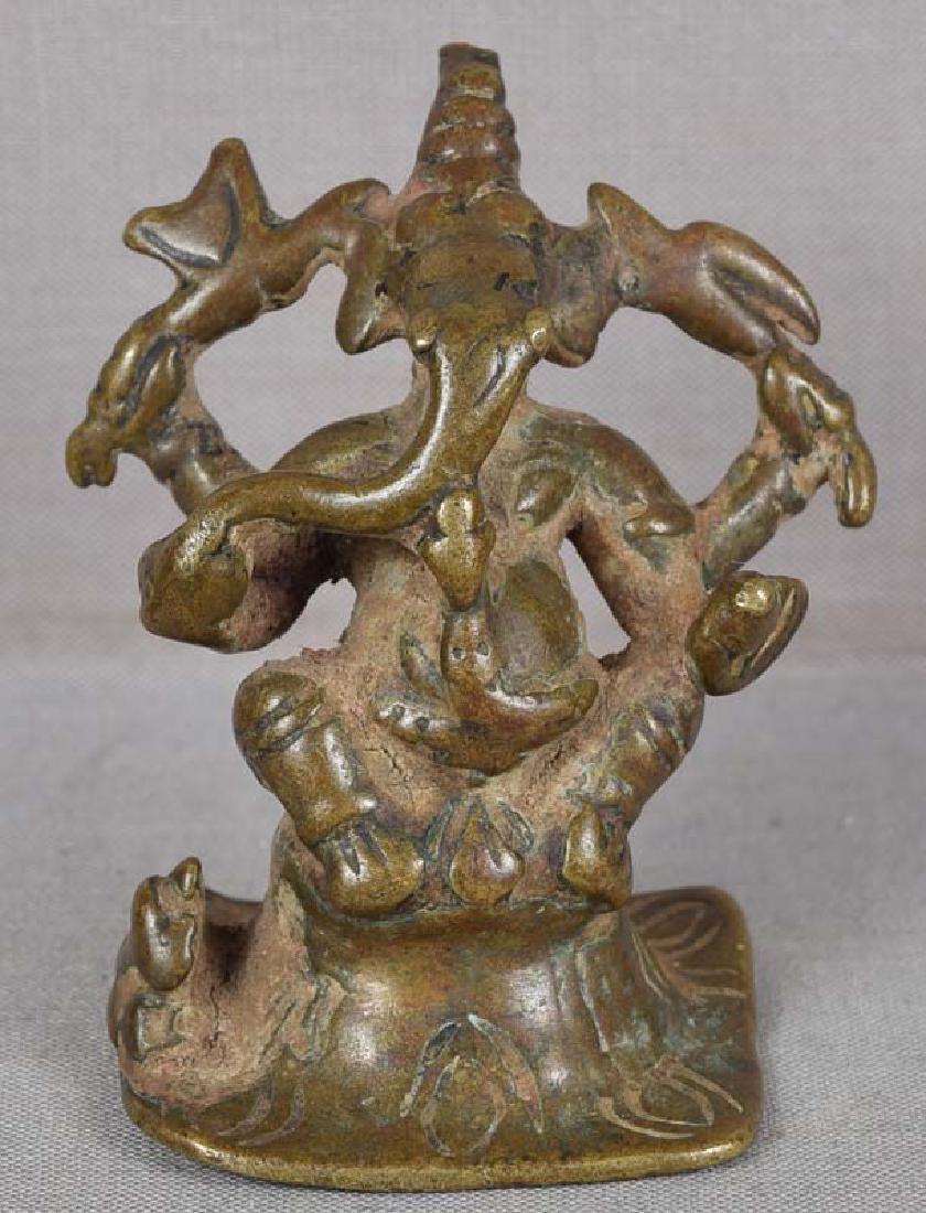 18c Indian bronze GANESHA with rat: 18th century votive Indian bronze sculpture of Ganesha sitting on a lotus base, with his vahana (vehicle) - a bandicoot rat - to his right. Ganesha bestows good luck on his worshippers: he is the remo