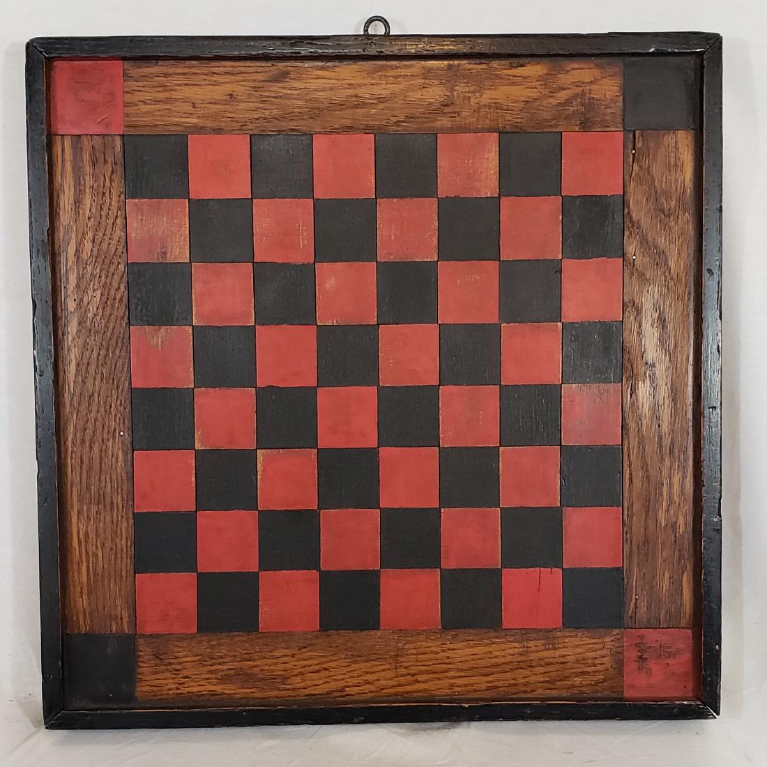 Red and black checkers board ca 1890. (1 of 3)