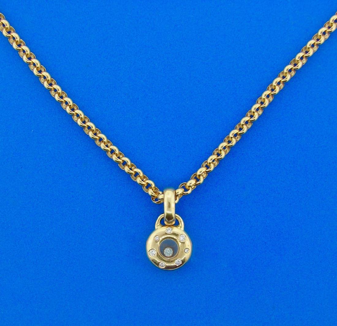 CUTE AND FUN Chopard 18k Yellow Gold Happy Diamonds: AK JN00 Chopard 18k Yellow Gold Happy Diamonds Necklace· Wonderful necklace by Chopard that is a great addition to your collection. · Weight is 22.4 grams · Made of Diamonds (0.35 carats), 18k Yell