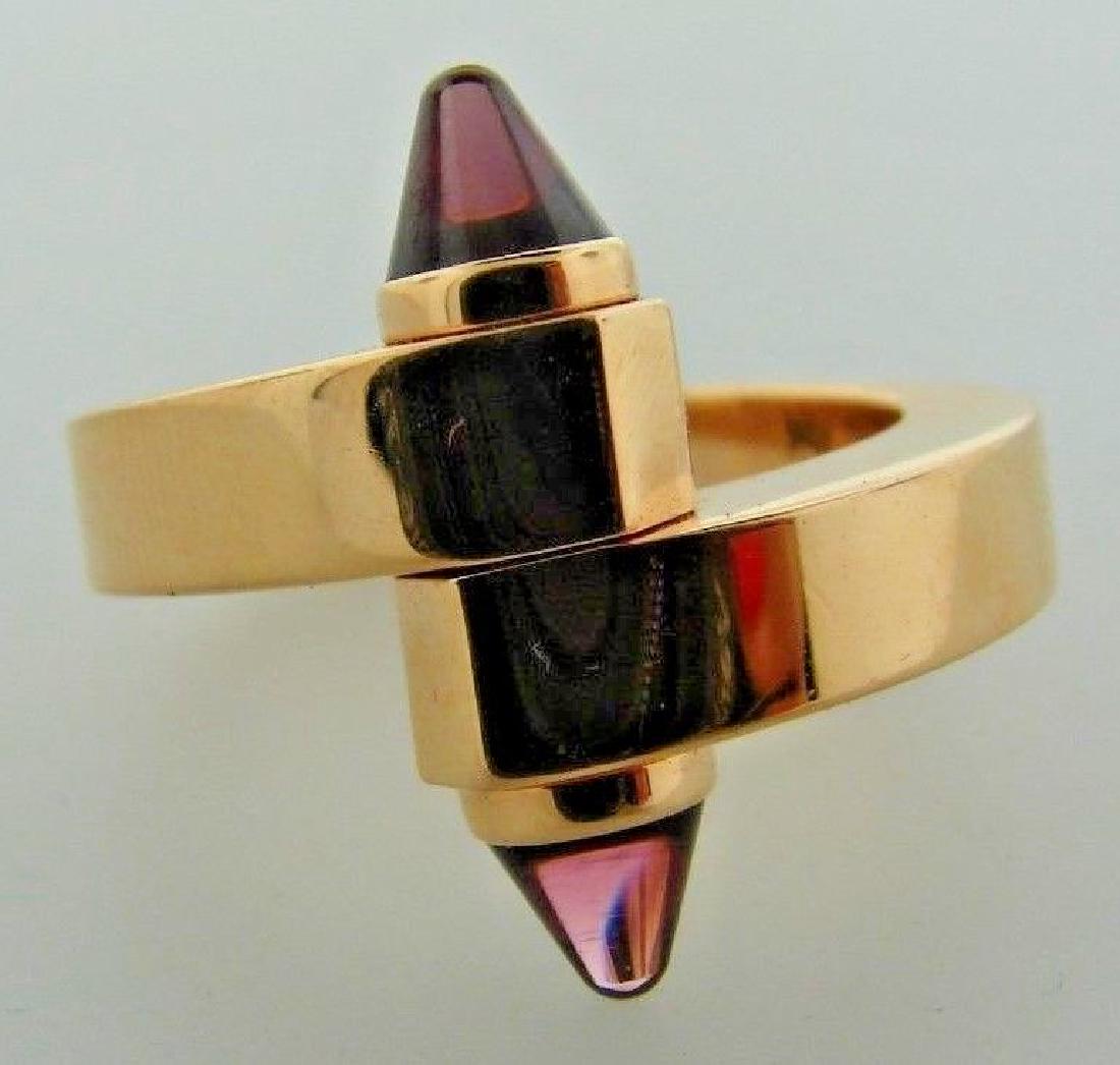 WOW Cartier Menotte 18k Rose Gold & Rhodolite Garnet: 310.860.9991 DK Cartier Menotte 18k Rose Gold & Rhodolite Garnet Bypass Ring · Wonderful ring that is a necessity in your collection. · The weight is 17.2 grams.· The height is ¾ of an inch. The w