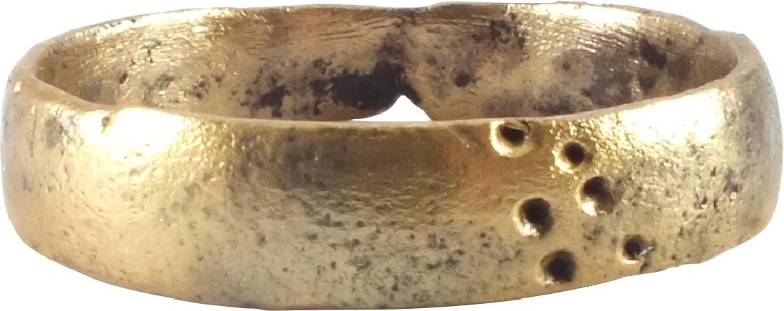 VIKING WEDDING RING, 9th-10th CENTURY AD, Sz 10: Gilt bronze, size 10. Rounded face band with a cluster of punches and two other figures, perhaps runes. The gold surface professionally restored. Rare form of decoration. Vikings exchanged rings on th