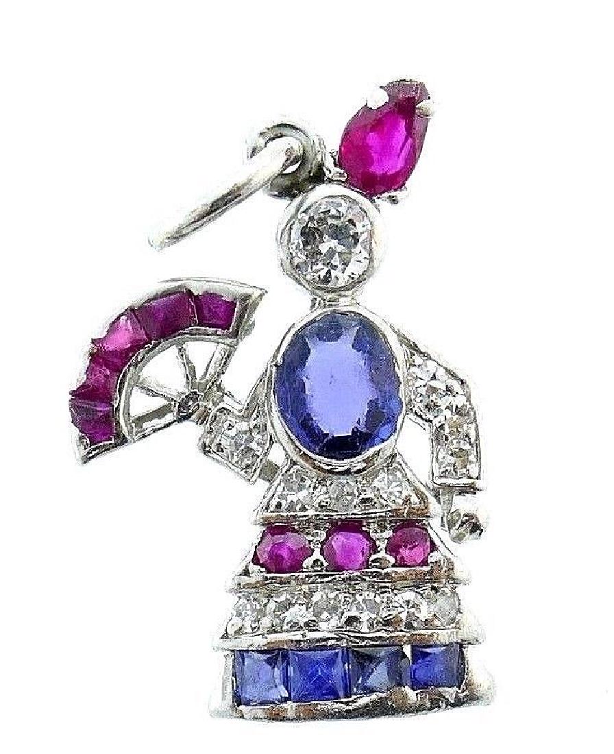 Art Deco Platinum Diamond Gemstone Lady With A Fan: 90212NS ET0 Art Deco platinum diamond gemstone Lady with a Fan charm Features natural stones: sapphire and ruby Measurements: 5/8" W (a widest part) x 1" L Weight is 3.0 grams In excellent condition;