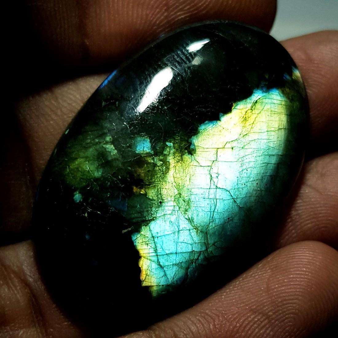 49.53 ct Natural Labradorite: No Reserve! Title: 49.53 ct Natural Labradorite Color/Clarity: Opaque Gemstones: Gemstones Carat Weights: 49.53 Size/Dimensions: 38.22 x 24.55 x 6.42 Additional Information: Oval - USA Shipping: