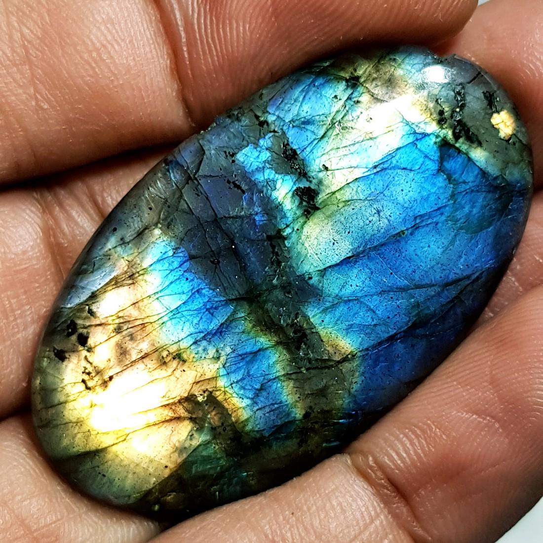 54.50 ct Natural Labradorite: No Reserve! Title: 54.50 ct Natural Labradorite Color/Clarity: Opaque Gemstones: Gemstones Carat Weights: 54.5 Size/Dimensions: 44.08 x 25.21 x 5.84 Additional Information: Oval - USA Shipping:<
