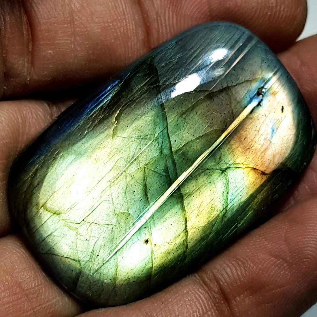 89.10 ct Natural Labradorite: No Reserve! Title: 89.10 ct Natural Labradorite Color/Clarity: Opaque Gemstones: Gemstones Carat Weights: 89.1 Size/Dimensions: 41.60 x 27.40 x 8.24 Additional Information: Rectangular - USA Shippin