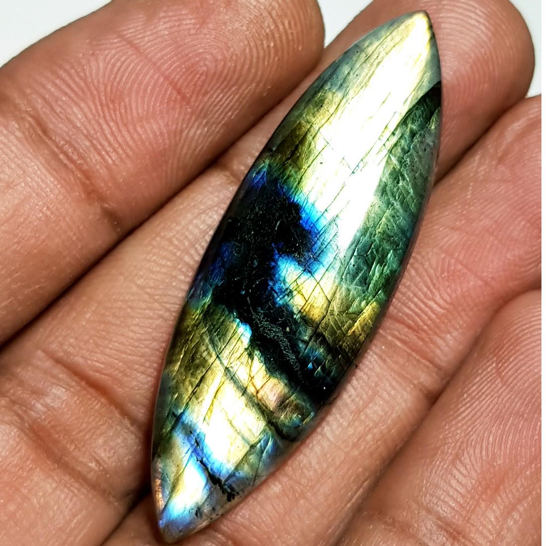 30.91 ct Natural Labradorite: No Reserve! Title: 30.91 ct Natural Labradorite Color/Clarity: Opaque Gemstones: Gemstones Carat Weights: 30.91 Size/Dimensions: 45.71 x 14.79 x 6.07 Additional Information: Marquise - USA Shipping: