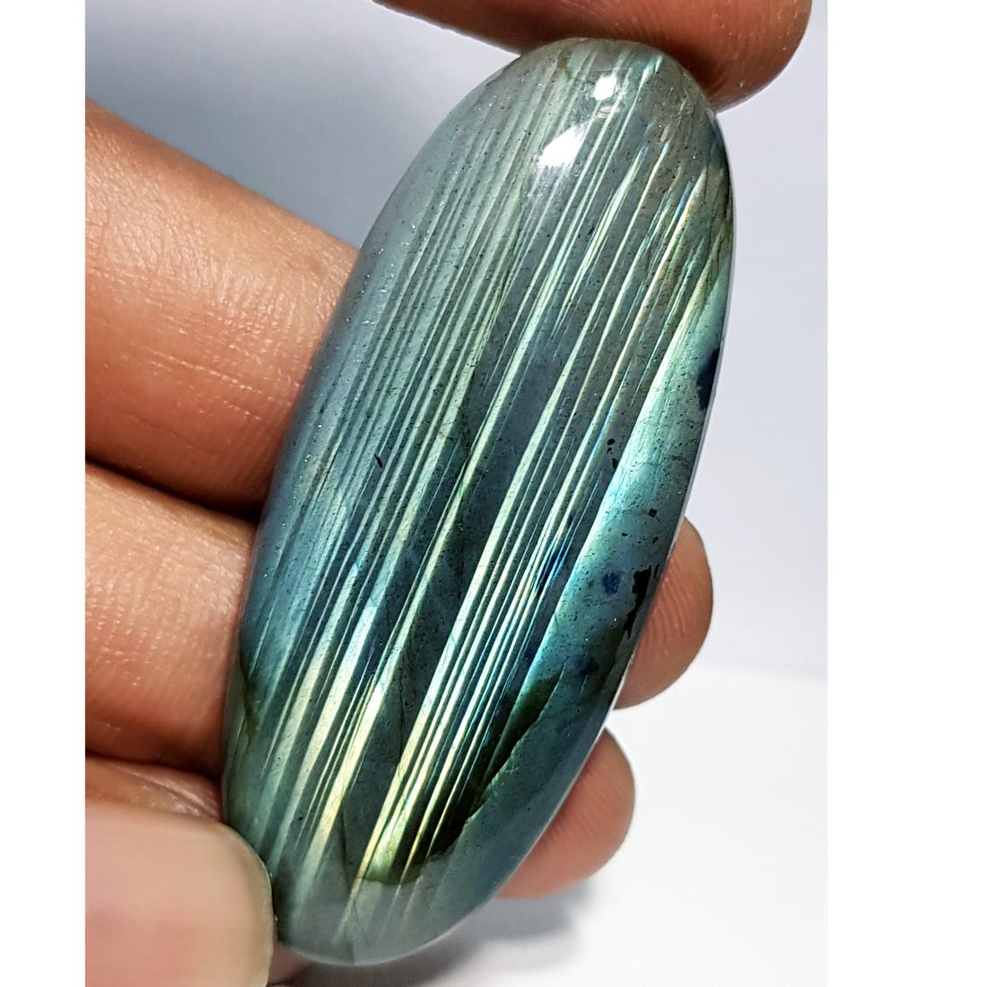 68.90 ct Natural Labradorite: No Reserve! Title: 68.90 ct Natural Labradorite Color/Clarity: Opaque Gemstones: Gemstones Carat Weights: 68.9 Size/Dimensions: 53.35 x 22.51 x 6.48 Additional Information: Oval - USA Shipping:<