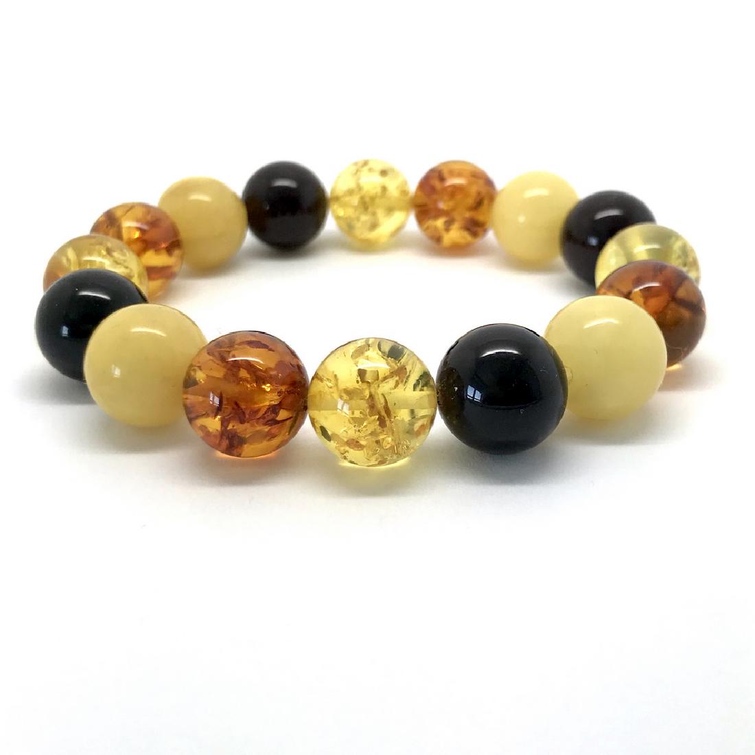 Baltic amber bracelet with beads ø12.7mm: Item: Baltic amber bracelet with beads ø12.7mm Weight: 19.0 gr Size: bead size 12.7 mm in diameter. Total length 17 cm 4 colours of Baltic amber: lemon, cognac, egg yolk and cherry Reserve: $90.00 Sh