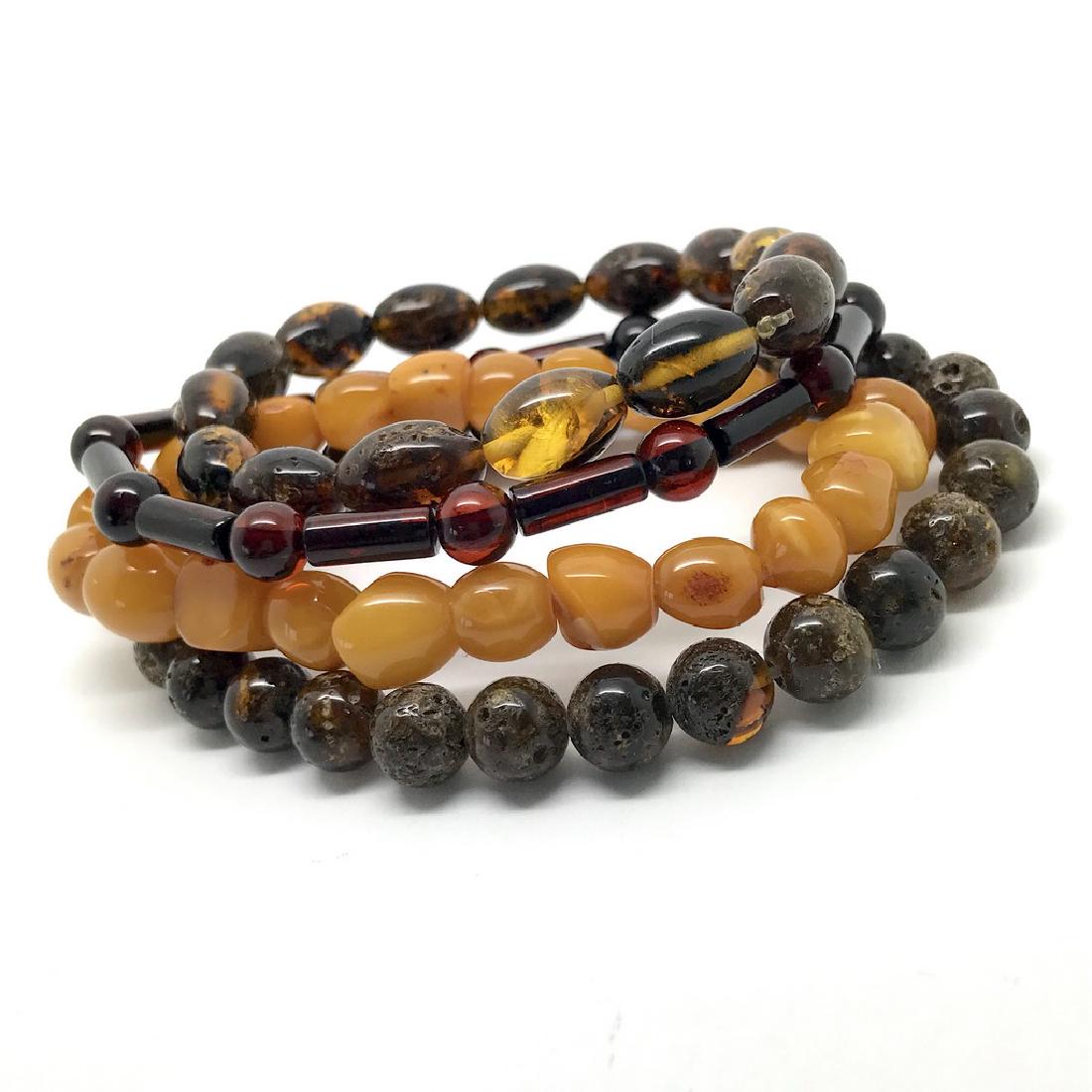 Bracelets Baltic amber handa carved beads: Item: Bracelets Baltic amber handa carved beads Weight: 24.9 grams Size: beads size 6-11 mm colour: butterscotch, cherry, cognac; wrist size approx.16 cm Reserve: $75.00 Shipping: Worldwide: Flat-rate