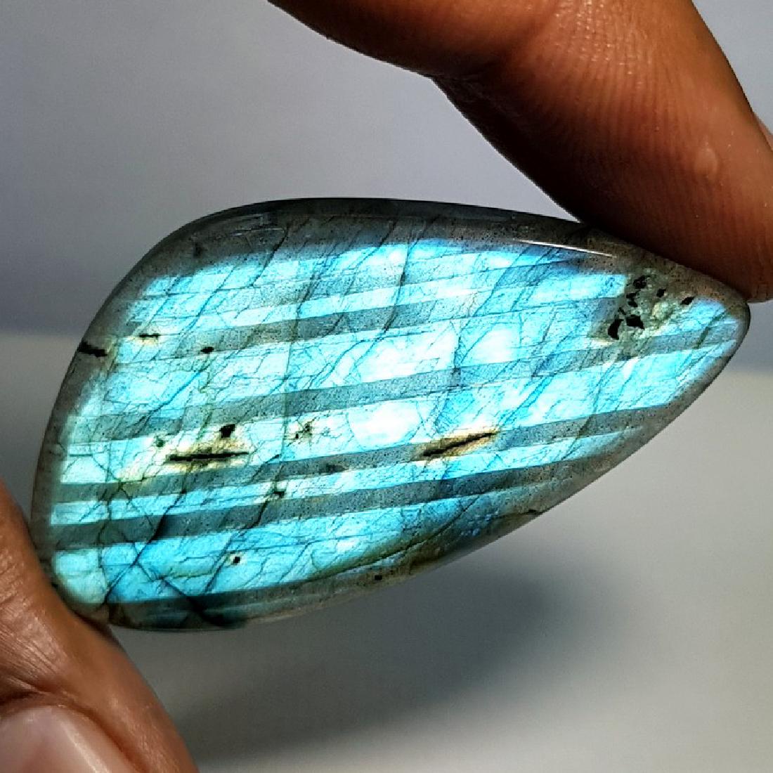 47.20 ct Natural Labradorite: No Reserve! Title: 47.20 ct Natural Labradorite Color/Clarity: Opaque Carat Weights: 47.2 Size/Dimensions: 46.13 x 25.86 x 4.90 Additional Information: Fancy - USA Shipping: Worldwide: Flat-rate of