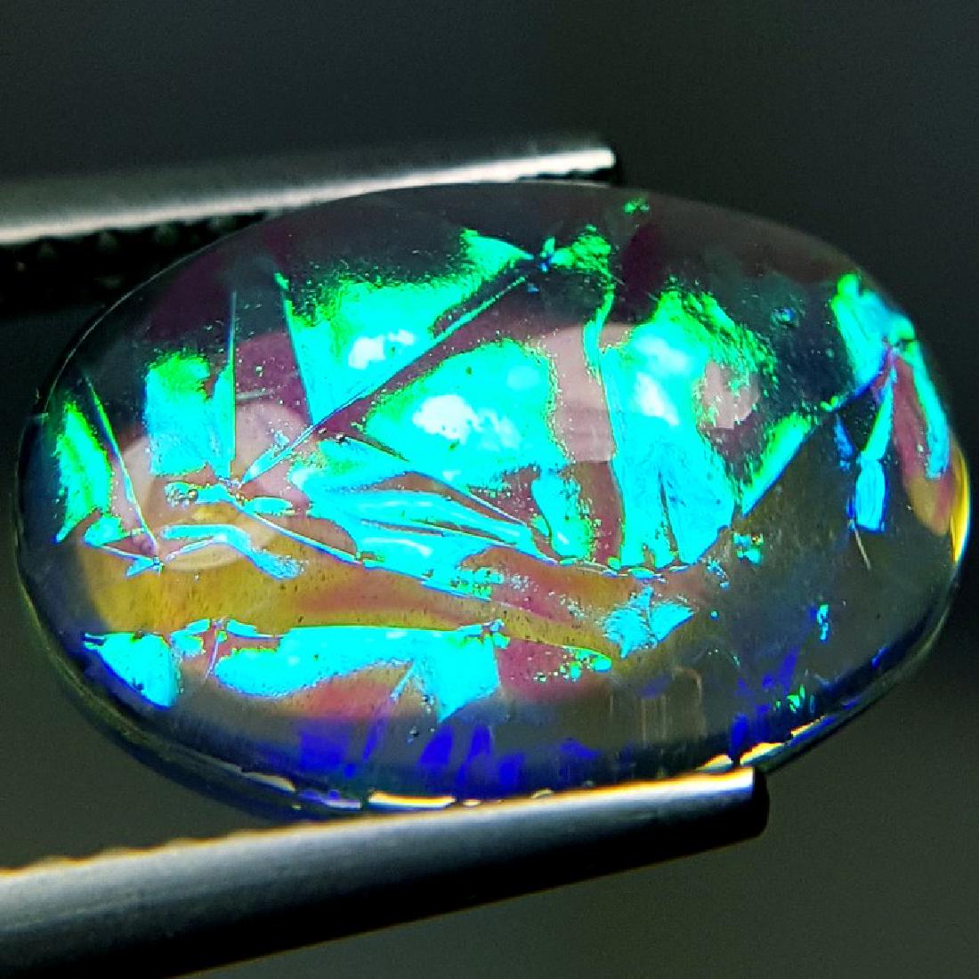 5.40 ct Australian Doublet Opal: No Reserve! Title: 5.40 ct Australian Doublet Opal Color/Clarity: Opaque Carat Weights: 5.4 Size/Dimensions: 14.01 x 10.08 x 5.10 Additional Information: Oval - Australia Shipping: Worldwide: Flat-r
