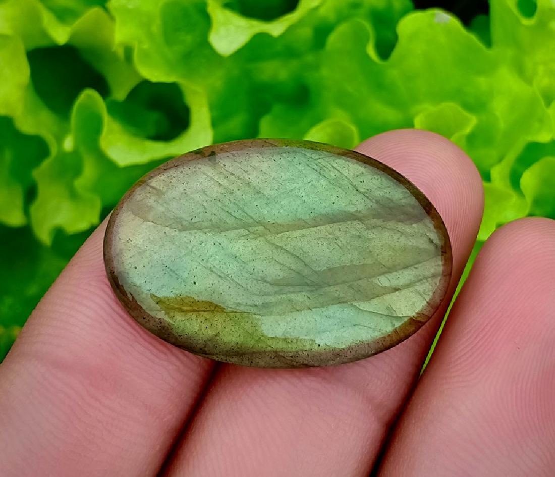25.75 Carat Beautiful Natural Labradorite Cab ~ Africa: Reserve Reduced! Title: 25.75 Carat Beautiful Natural Labradorite Cab ~ Africa Color/Clarity: None Gemstones: Labradorite Carat Weights: 25.75 Carat Size/Dimensions: 30x20x4.5 mm Origin: Africa Treatm